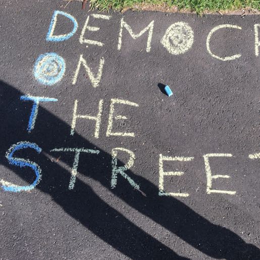 Democracy On The Streets. Yellow. Chalk. Example.