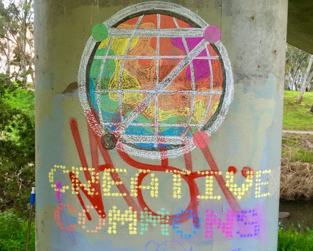 Example of Long Game Meme: 'Creative Commons' in chalk on pillar