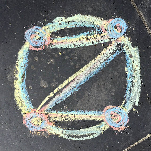 rainbow dotZero symbol in chalk on tile